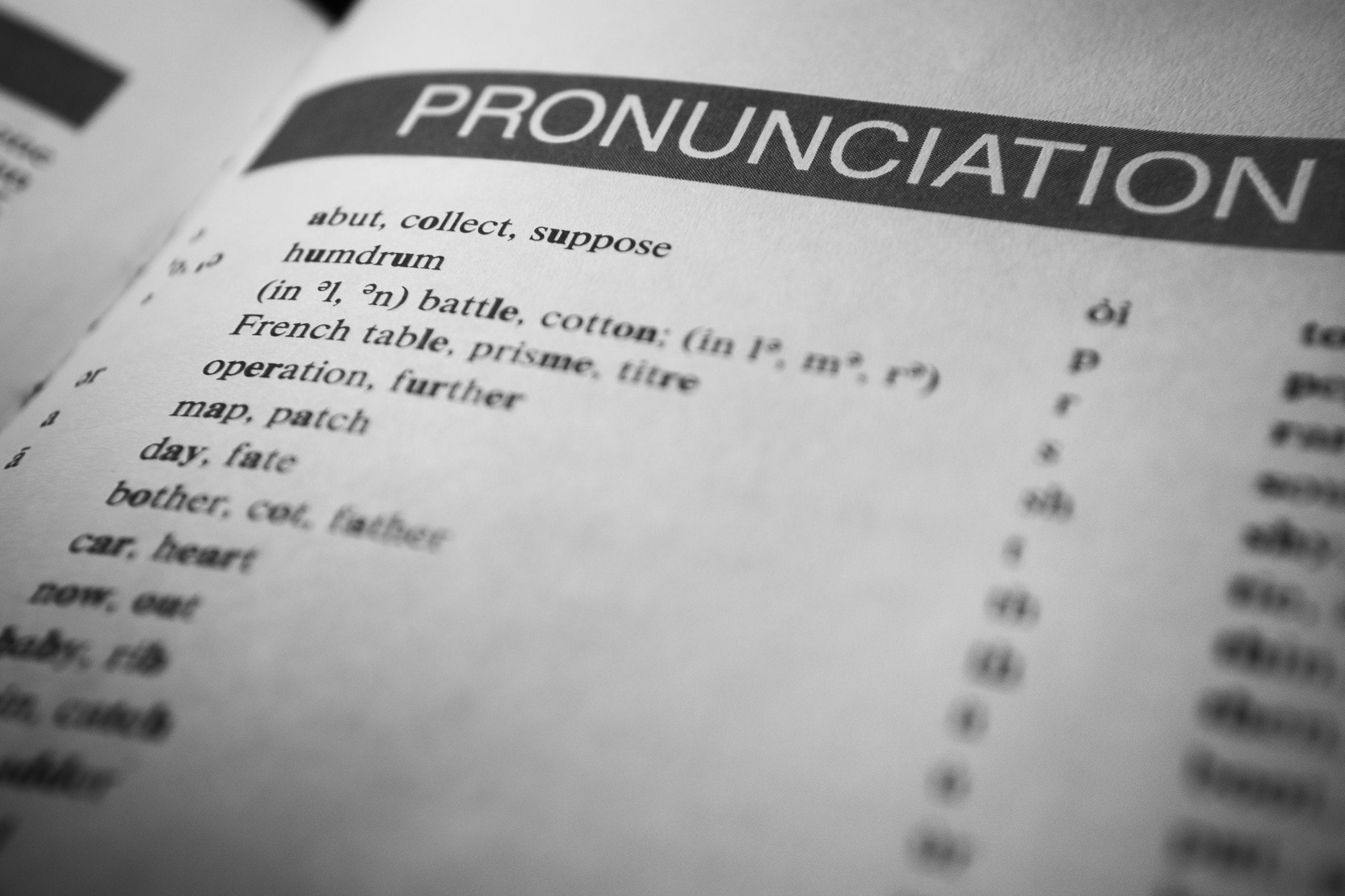 Received Pronunciation or Speaking English like the Queen Black and white close-up of a dictionary page focused on pronunciation guides and phonetic symbols.